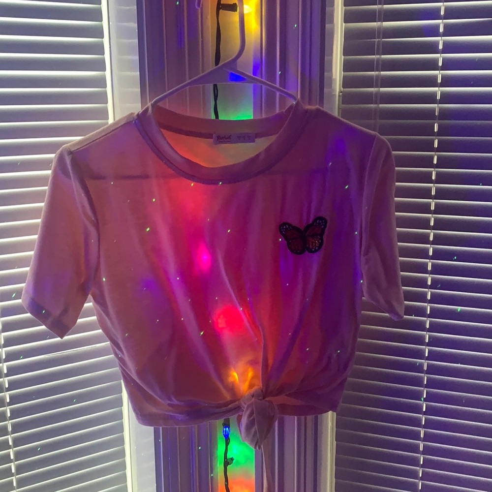 A light pastel pink crop top